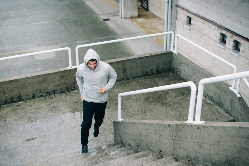 Man running on urban stairs